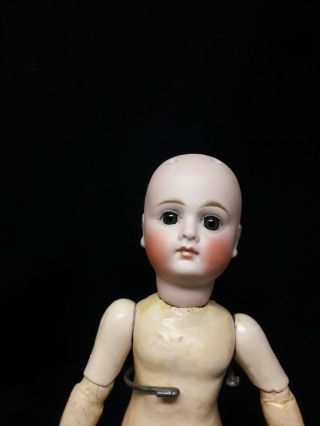 Antique German Bisque Doll with Closed Mouth and Paper Weight Eyes 2