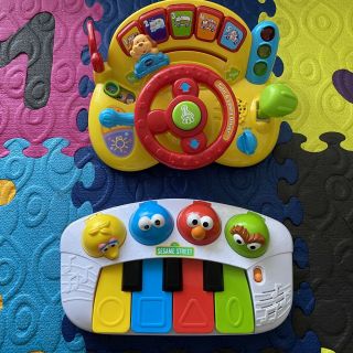 Bundle Of 2 Musical Toys - Sesame Street Singing Friends Piano & V Tech Driver