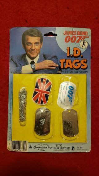 James Bond Rare 1984 Imperial Toys I.  D.  Tag Set.  Roger Moore On Package