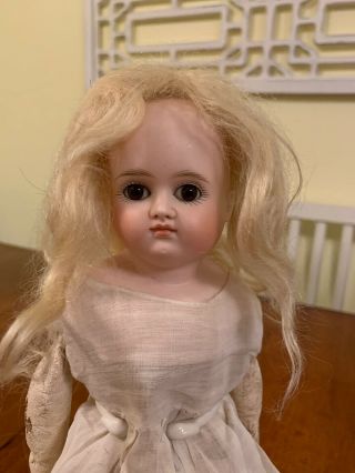 Antique German Bisque Kestner Closed Mouth Turned Shoulder Head Brown Eyed Doll.
