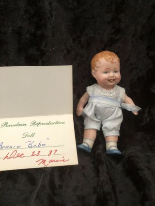 Antique 4.  75” Bisque Bonnie Babe Doll