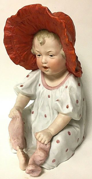Vintage Heubach 7.  5” Bisque Porcelain Piano Baby Sitting Girl In Orange Bonnet