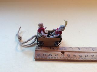 Wonderful Pair All Bisque Carl Horn Dolls In An Old Wooden Wagon