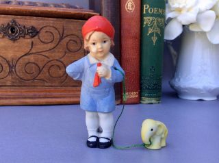 Antique German All Bisque Hertwig 3” Doll Boy With Tiny Pet Elephant On Leash