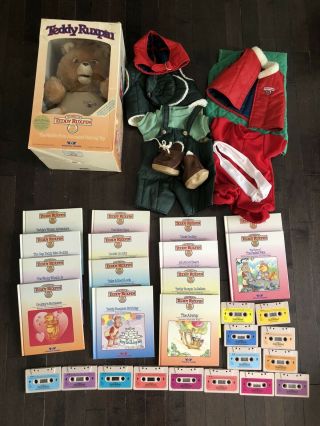Vintage Teddy Ruxpin Teddy Bear 1985 With 14 Cassettes And Books And 4 Outfits.