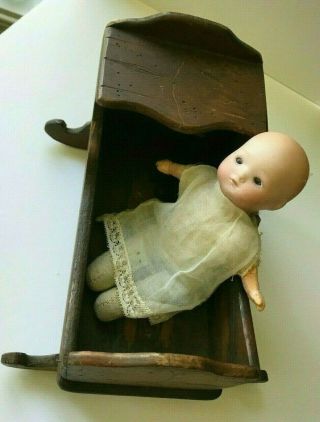 Miniature German Bisque Baby Doll 6 " W/cloth Body And Squeaker With Cradle