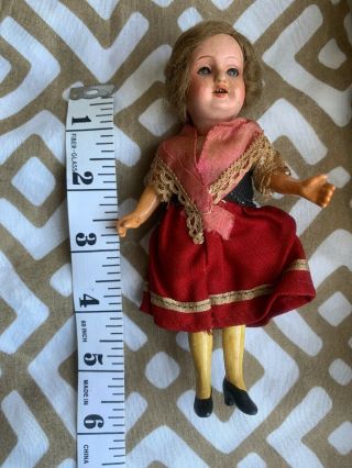 German Bisque Doll.  Marked 14/0.  Just Under 6”.  Glass Eyes.  Inset Teeth