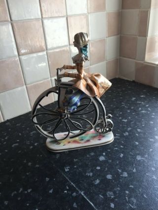 Febland ornament of a lady on a penny farthing 2