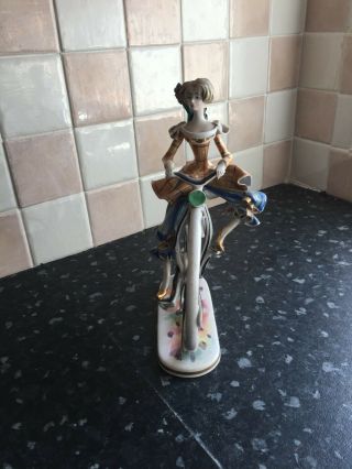 Febland ornament of a lady on a penny farthing 3