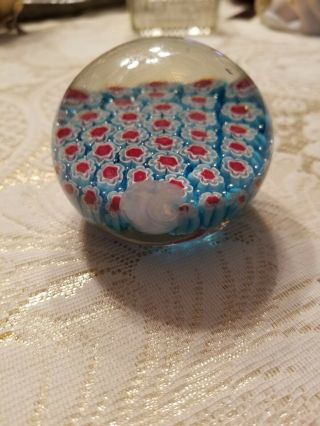 Millefiori glass paperweight,  2.  5 inches in diameter.  One abrasion. 2