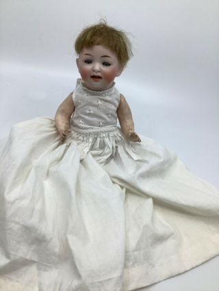 Antique 8” Doll Porcelain Bisque Head And Composition Body.  Two Tiny Teeth