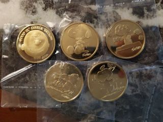 Charles M.  Schulz Museum Snoopy And Charlie Brown Five Medallion Coin Token Set