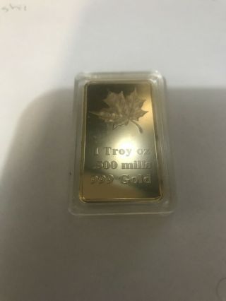 1 Oz Maple Leaf.  500 Mills Gold Plated Bar
