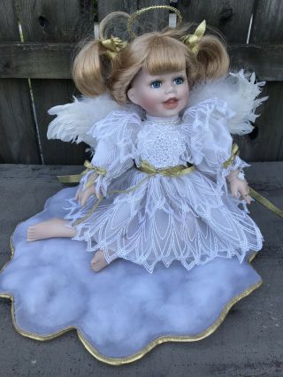 Baby’s Dream Angel Porcelain Doll