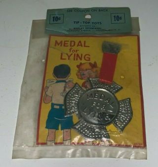 Vintage 5 & 10 Tin Toy,  " Medal For Lying " Tin Pin / Badge (package)