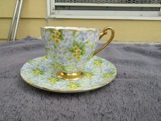 Shelley Primrose Chintz Teacup Saucer Gold Rim Yellow Flowers Footed