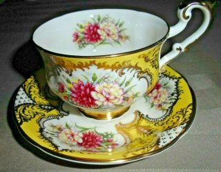 Vintage Paragon Footed Yellow And Gold With Carnations Tea Cup And Saucer