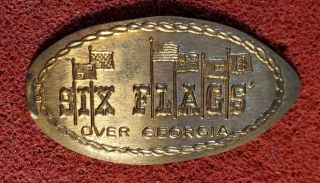 Six Flags Over Georgia Elongated Penny On A 1974 D Cent (el - 7)