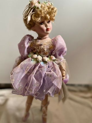 Porcelain Doll Ballerina Pointe Shoes On Stand Purple Dress