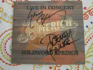 America Live In Concert At Wildwood Springs Signed By Both