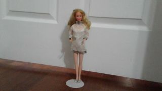 Barbie Doll Wearing White Dress With Silver Trim Stand