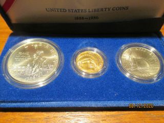 1986 U.  S.  Liberty 3 - Coin Uncirculated Set: $5 Gold; Silver $1 & C/n Half Dollar