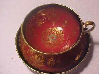 Paragon Cup And Saucer Dark Maroon W/ Black,  Gold And Enamel Pretty