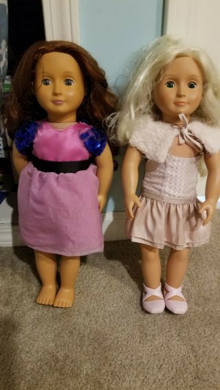 2 Our Generation Dolls With Extra Clothes