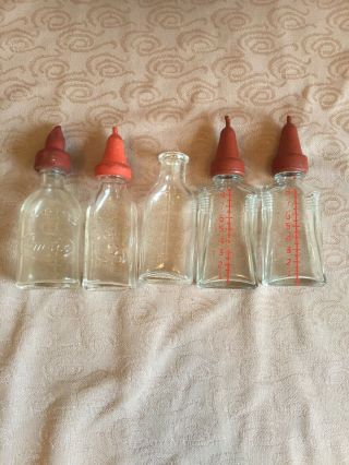 5 Vintage Miniature Glass Doll Baby Bottles 1 Embossed With Dog,  1 Amsco,  Etc