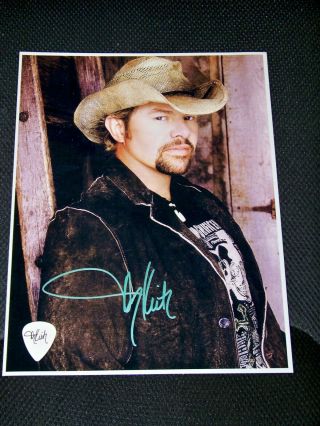 Toby Keith Signed Picture And Guitar Pick,