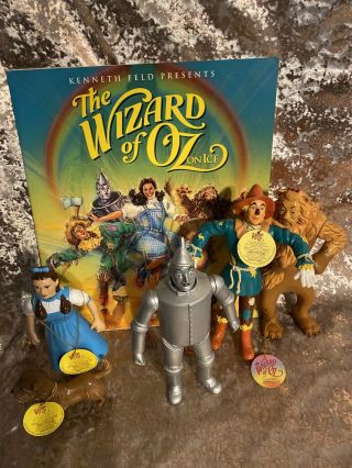 Wizard Of Oz On Ice Program 1995 & Figures.  Dorthy,  Lion,  Scarecrow,  Tim Man,  & Toto