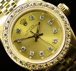 Rolex Ladies Oyster Perpetual 18k Gold Champagne Diamond Dial Bezel