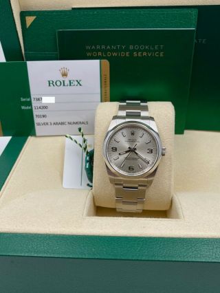 Rolex 114200 Oyster Perpetual Silver Dial Stainless Steel Box Papers