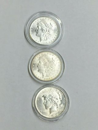 1899 E Pluribus Unum,  1921 E Pluribus Unum,  1922 Liberty Peace One Dollar Coins