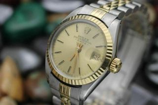 C.  1973 Rolex Oyster Perpetual Date Ref.  6917 14k Gold And Steel Women 