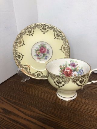 Paragon Yellow and Gold Footed Tea Cup and Saucer with Flowers 2
