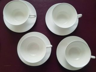 Set Of 4 White China Tea Cups With Matching Saucers Plus 1 Bonus Saucer