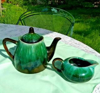Blue Mountain.  Pottery Tea Pot & Creamer Green Over Black Drip Glaze -