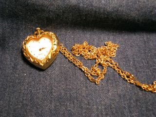 Avon - Gold Tone Heart Shaped Watch Necklace With 30 " Gold Tone Chain Running