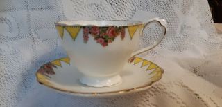Paragon Double Warrant Rose Garland And Yellow Teacup & Saucer