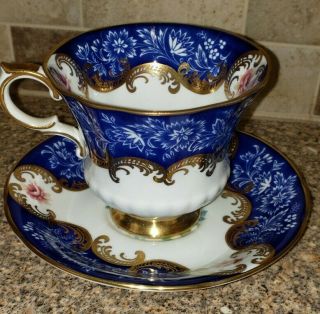 Paragon Cobalt Blue Cup And Saucer Gold Scrolls.  Repaired.