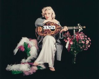 Marilyn Monroe Poses For A Portrait With A Lute Photo