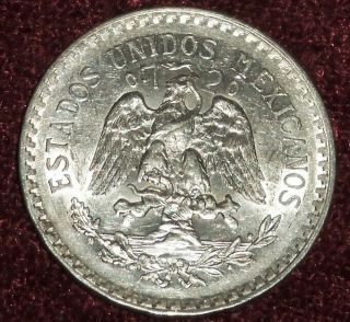 Brilliant Unc.  1925 Cap & Ray Mexicanos Silver Un Peso,  Scarce Date
