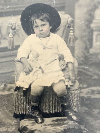 Antique Tintype Photo Little Girl In Hat Holding Two Dolls Sixth Plate Size