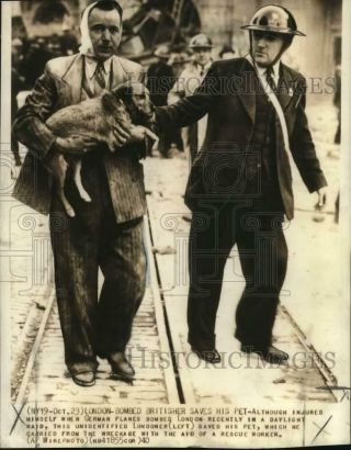 1940 Press Photo London Man And Dog Saved After Bombing,  World War Ii