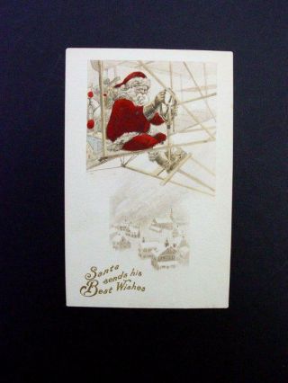 H92 - Vintage Xmas Postcard Santa On Old Fashioned Air Plane Over Town