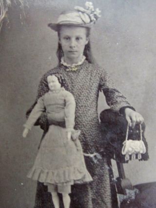 Antique Tintype Young Girl Holding a large Porcelain Doll and Iroquois Purse 2