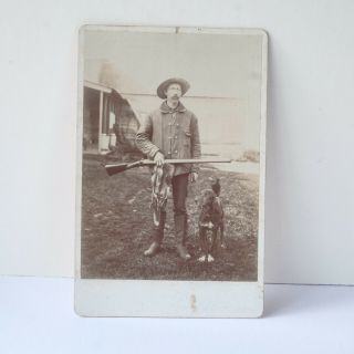 Old Photo Of Man With Dog And Shot Gun