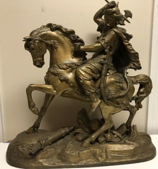 C.  Antique Warrior On Horseback,  21”l 21”h 8”d & 27 Lbs.  Gold Finish Metal Statue