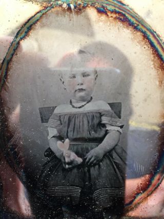 Daguerreotype Of A Young Boy In A Dress Holding A Stuffed Bunny